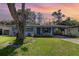 Charming single-story home featuring a well-maintained lawn, mature tree, and inviting curb appeal at 436 Azores Ave, Orlando, FL 32811