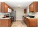 Functional kitchen with wood cabinets, granite countertops, and stainless steel appliances at 436 Azores Ave, Orlando, FL 32811