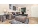 Comfortable living room featuring a plush sectional sofa, neutral walls, and stylish decor at 436 Azores Ave, Orlando, FL 32811