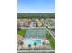 Excellent aerial view showcasing the pool, tennis courts and proximity of community to recreation and nature at 5126 Saint Charles Ln # 43, Orlando, FL 32822