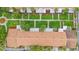 Aerial view of community, showcasing well-manicured lawns, walkways, and a layout with uniform building design at 5126 Saint Charles Ln # 43, Orlando, FL 32822