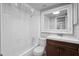 Bathroom featuring a bathtub with shower, toilet, and vanity with mirror at 5126 Saint Charles Ln # 43, Orlando, FL 32822