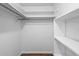 Walk-in closet featuring built-in shelving for optimal storage and organization at 5126 Saint Charles Ln # 43, Orlando, FL 32822
