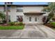 Charming townhome featuring a cozy front porch, landscaped yard, and a well-maintained exterior at 5126 Saint Charles Ln # 43, Orlando, FL 32822