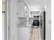 Modern kitchen with white cabinets, stainless steel appliances and granite countertops at 5126 Saint Charles Ln # 43, Orlando, FL 32822
