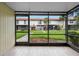 Relax on the screened lanai with a view of the building's green space, offering a peaceful outdoor retreat at 5126 Saint Charles Ln # 43, Orlando, FL 32822
