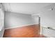 Spacious living room featuring hardwood floors, neutral walls, and plenty of natural light at 5126 Saint Charles Ln # 43, Orlando, FL 32822