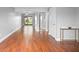Expansive living room with hardwood floors and sliding glass doors leading to the outdoors at 5126 Saint Charles Ln # 43, Orlando, FL 32822