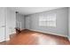 Inviting living room showcasing hardwood floors, staircase, and a bright, airy atmosphere at 5126 Saint Charles Ln # 43, Orlando, FL 32822