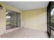 Enjoy outdoor relaxation on this screened patio with tile floors and a comfortable chair at 5126 Saint Charles Ln # 43, Orlando, FL 32822