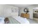 Bright bedroom features neutral walls, plush carpeting, stylish decor and access to bathroom with dual vanity at 6006 Galloping Dr, Apopka, FL 32712
