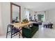 Bright dining area featuring a modern table set, decor, and an open layout leading to the living room at 6006 Galloping Dr, Apopka, FL 32712