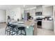 Stylish kitchen with granite countertops, stainless steel appliances, and a convenient breakfast bar with seating at 6006 Galloping Dr, Apopka, FL 32712