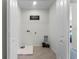 Bright laundry room with tile flooring, washer/dryer hookups and storage options at 6006 Galloping Dr, Apopka, FL 32712