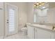 Bathroom with white vanity, tiled floor, and stained-glass door at 6609 Crenshaw Drive, Orlando, FL 32835