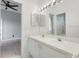 Bright bathroom with double vanity, large mirror, and updated shower at 6609 Crenshaw Drive, Orlando, FL 32835