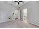 This bedroom has neutral walls, carpet, and access to an ensuite bathroom at 6609 Crenshaw Drive, Orlando, FL 32835