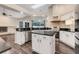 Open-concept kitchen with stainless steel appliances and granite countertops, next to the Gathering room at 6609 Crenshaw Drive, Orlando, FL 32835