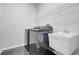 This laundry room has a modern washer, dryer, and utility sink at 6609 Crenshaw Drive, Orlando, FL 32835
