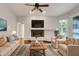 Living room with fireplace, hardwood floors and comfortable seating area at 6609 Crenshaw Drive, Orlando, FL 32835
