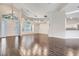 Large living area showcasing wood-look tile flooring, high ceilings, and plenty of natural light at 6609 Crenshaw Drive, Orlando, FL 32835