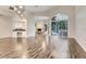 Bright open floor plan with tile flooring, a bar area, and access to the pool area at 6609 Crenshaw Drive, Orlando, FL 32835