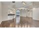 Spacious open floor plan with wood-look tile flooring, vaulted ceilings, and recessed lighting at 6609 Crenshaw Drive, Orlando, FL 32835