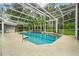 Sparkling screened pool with elegant landscaping and inviting atmosphere for relaxation and entertaining at 6609 Crenshaw Drive, Orlando, FL 32835
