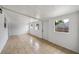 Bright bonus room features tile flooring, windows with ample light, and a door to the backyard at 772 Whippoorwill Dr, Orlando, FL 32825