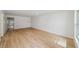 Bright living room boasting wood flooring and neutral walls, perfect for relaxation and entertaining at 772 Whippoorwill Dr, Orlando, FL 32825