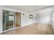 Enclosed patio with tile flooring and sliding glass doors leading to the kitchen at 772 Whippoorwill Dr, Orlando, FL 32825