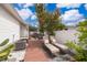 Inviting backyard with lush landscaping, a cozy lounge area, and a charming pergola at 824 Timor Ave, Orlando, FL 32804
