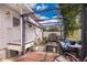 Cozy backyard patio with outdoor seating area and covered pergola, perfect for enjoying the outdoors at 824 Timor Ave, Orlando, FL 32804