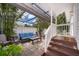 Outdoor patio area features a covered seating area, perfect for relaxation and entertaining at 824 Timor Ave, Orlando, FL 32804