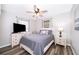 Comfortable bedroom with warm wood flooring, stylish furnishings, and natural light at 824 Timor Ave, Orlando, FL 32804