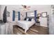 Comfortable bedroom with warm wood flooring, stylish furnishings, and natural light at 824 Timor Ave, Orlando, FL 32804
