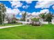 Attractive home featuring a lush green lawn, front porch, and a driveway, offering a warm invitation at 824 Timor Ave, Orlando, FL 32804
