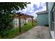 Cozy backyard featuring a pergola, shed, and freshly cut grass at 8718 Fort Shea Ave, Orlando, FL 32822