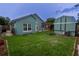Well-maintained backyard featuring a shed, pergola, and a lush green lawn at 8718 Fort Shea Ave, Orlando, FL 32822