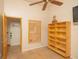 Bright bedroom featuring tile floors, a ceiling fan, and ample storage space at 8718 Fort Shea Ave, Orlando, FL 32822