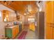 Charming kitchen featuring wood cabinets, stone floors, and stainless steel appliances at 8718 Fort Shea Ave, Orlando, FL 32822