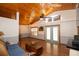 Spacious living room with vaulted wood ceiling, hardwood floors, and lots of natural light at 8718 Fort Shea Ave, Orlando, FL 32822