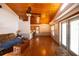 Open-concept living room with hardwood floors, and seamless flow to the kitchen at 8718 Fort Shea Ave, Orlando, FL 32822