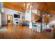 Open-concept living room featuring a brick fireplace and wood flooring at 8718 Fort Shea Ave, Orlando, FL 32822