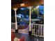 Water feature with pond, plants, and decorative rocks in the front yard seen from the porch at night at 8718 Fort Shea Ave, Orlando, FL 32822
