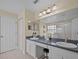 The primary bathroom features dual sinks, a vanity area, and a separate shower at 9034 Paolos Place Paolos Place, Kissimmee, FL 34747