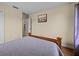 Simple bedroom with neutral walls and wood-look floors at 9034 Paolos Place Paolos Place, Kissimmee, FL 34747