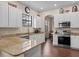 Bright kitchen featuring granite countertops, stainless steel appliances, and white cabinetry at 9034 Paolos Place Paolos Place, Kissimmee, FL 34747