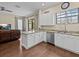 Bright kitchen with an island bar, granite countertops, stainless steel appliances and tile floors at 9034 Paolos Place Paolos Place, Kissimmee, FL 34747
