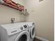 Laundry room with new side-by-side Samsung washer and dryer at 9034 Paolos Place Paolos Place, Kissimmee, FL 34747